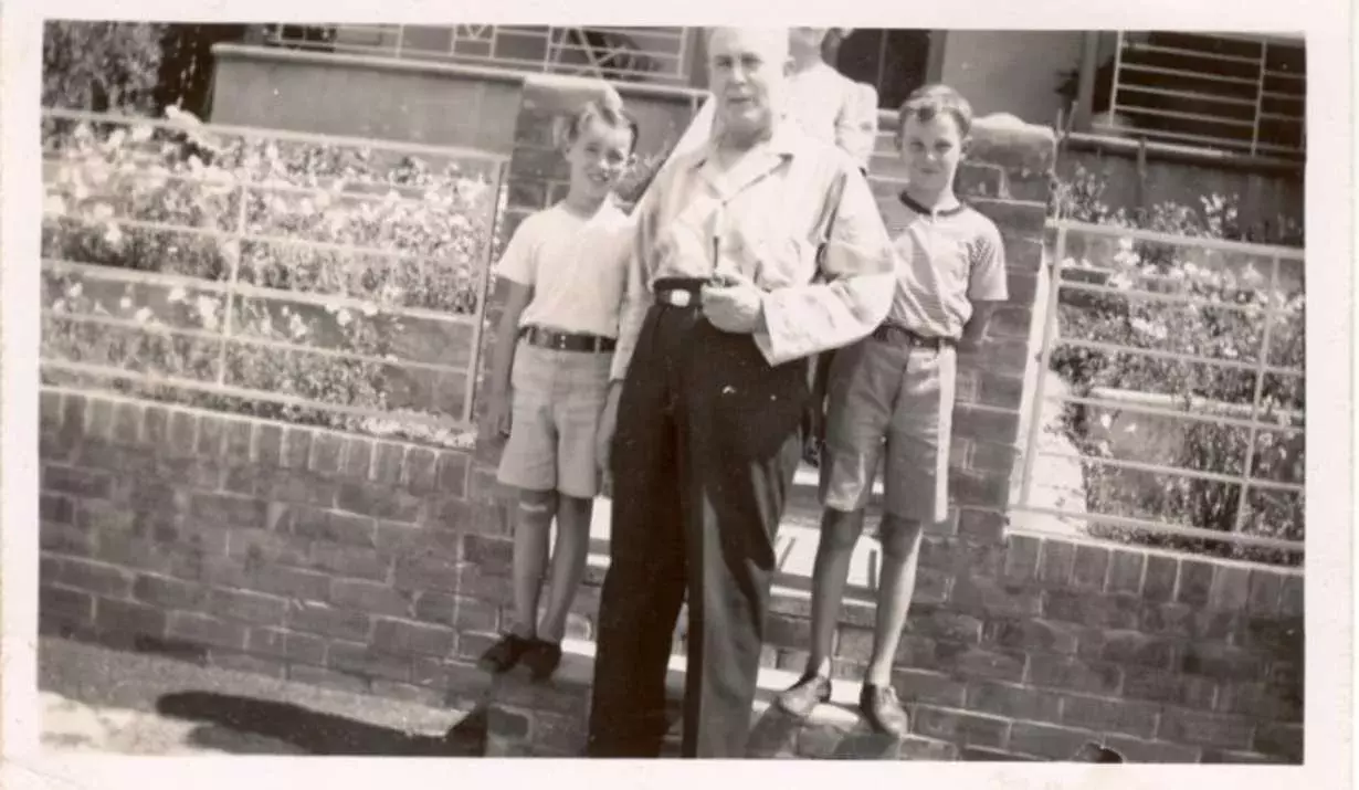 Ben Chifley with children at the front gate of his home at 10 Busby St, Bathurst