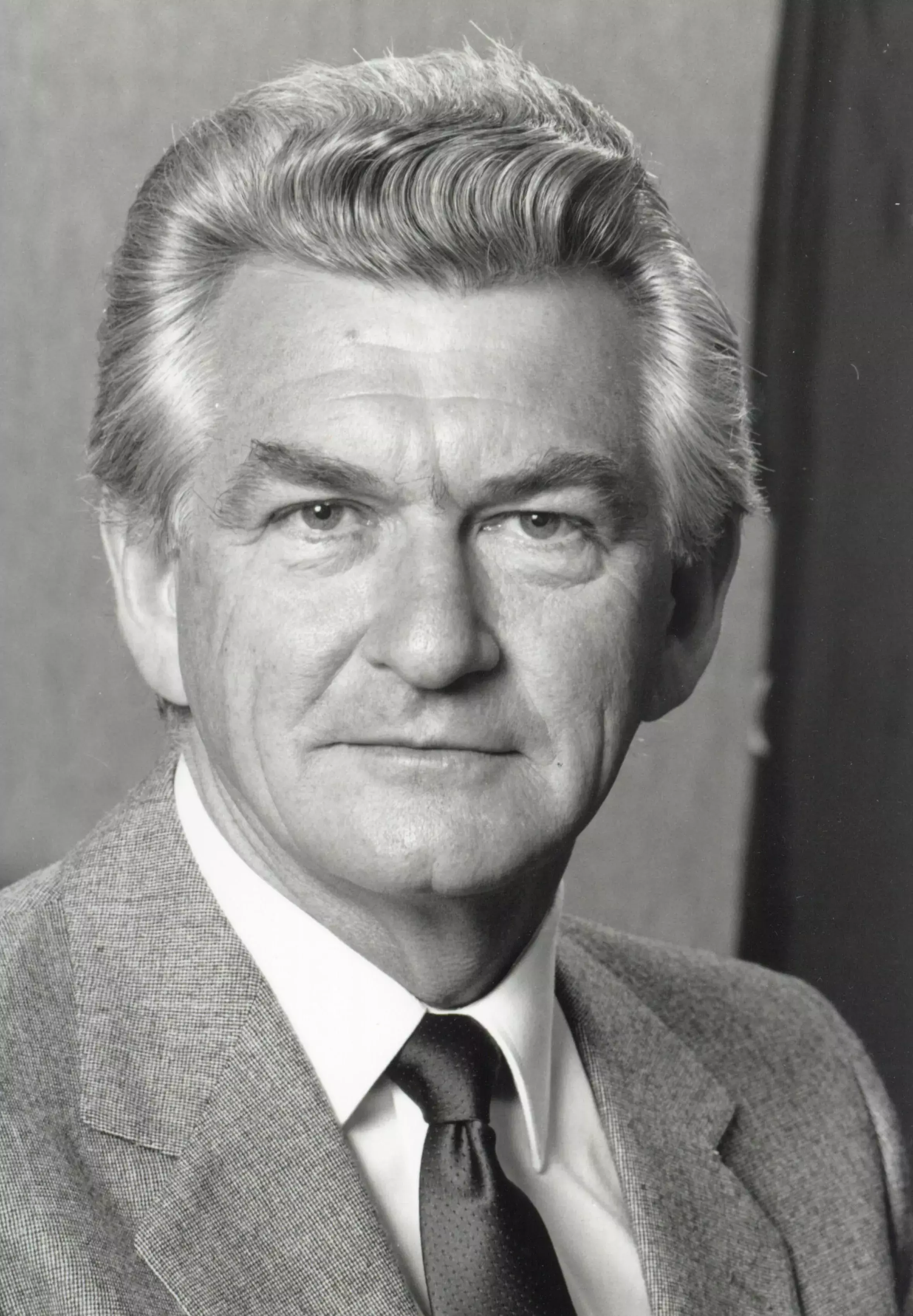 A face-on black and white portrait of Bob Hawke in 1983.  