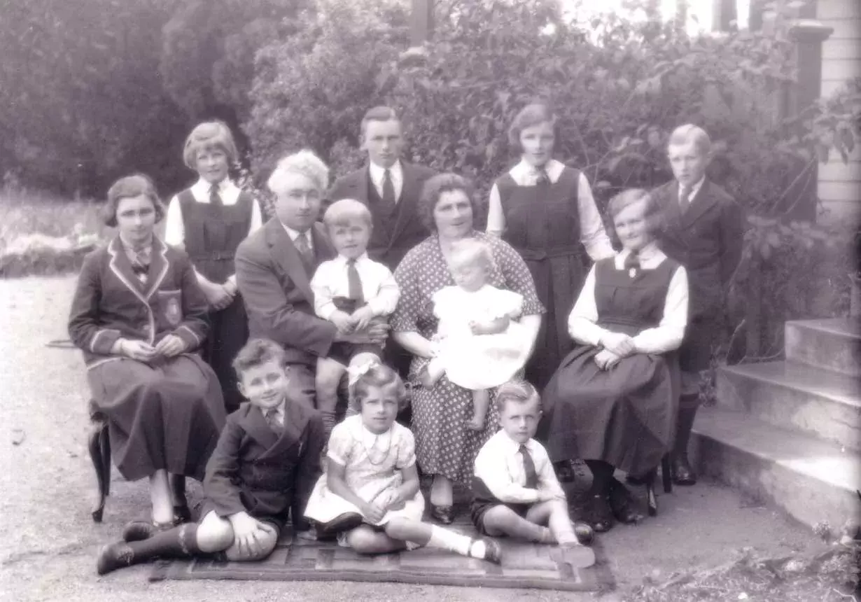 The Lyons family pose for a black and white photo, taken in 1935. 