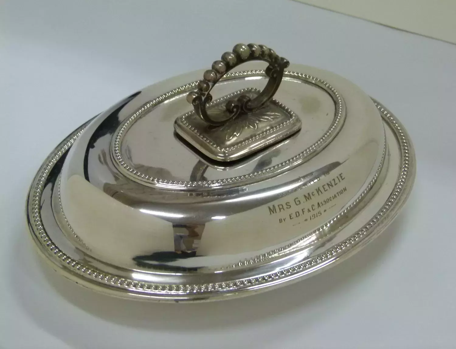 Silver entree dish lid with engraving. 