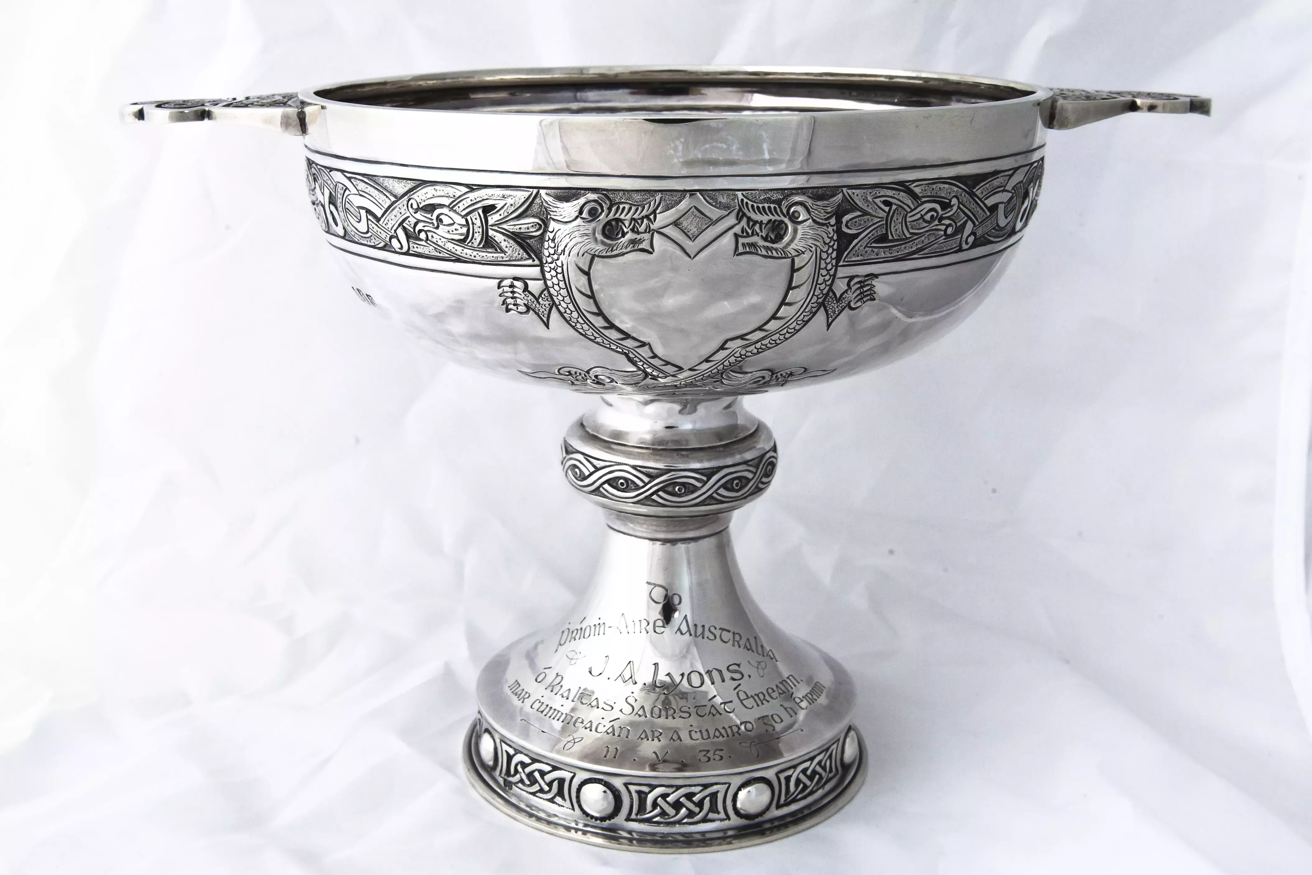 An ornate silver goblet with engraved decorations 